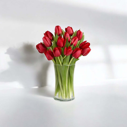 Bouquet of 15 red tulips arranged in a glass vase for flower delivery in Los Angeles