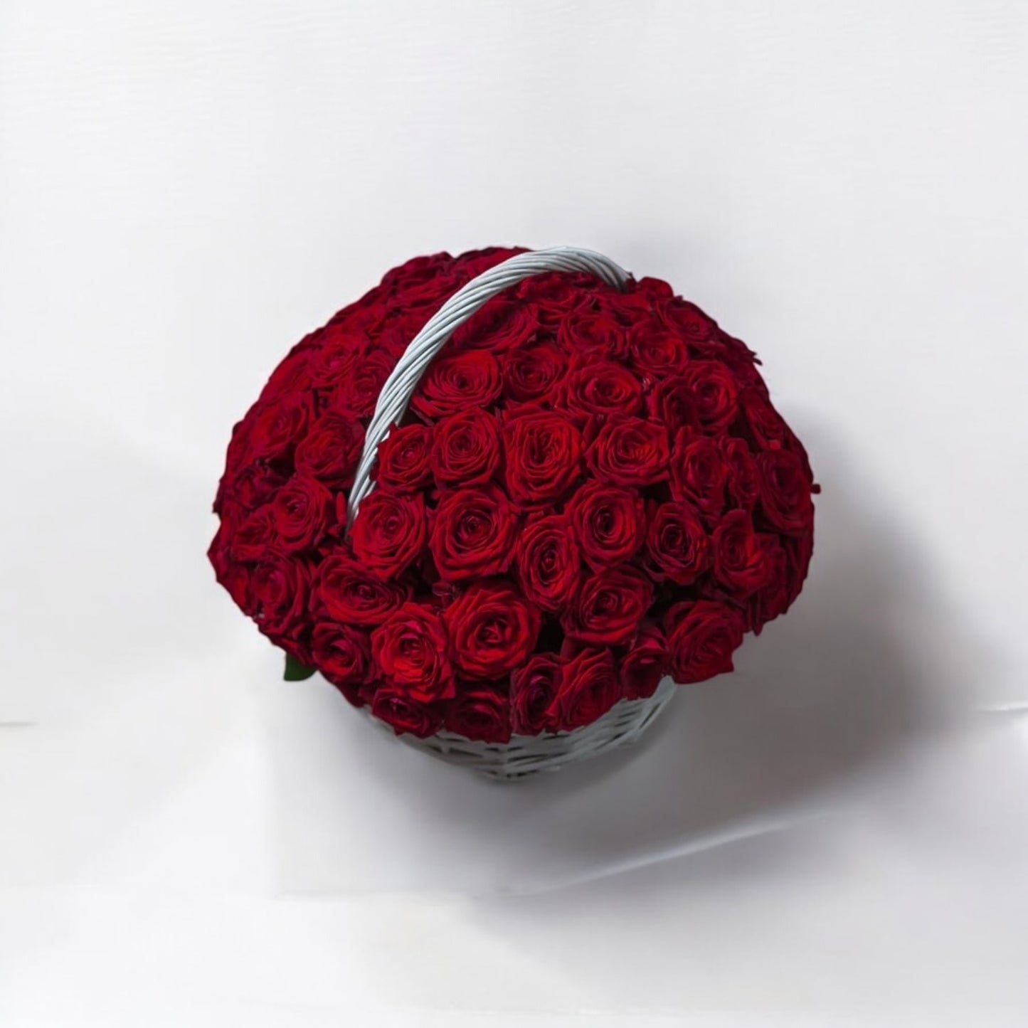 50 red roses in a basket