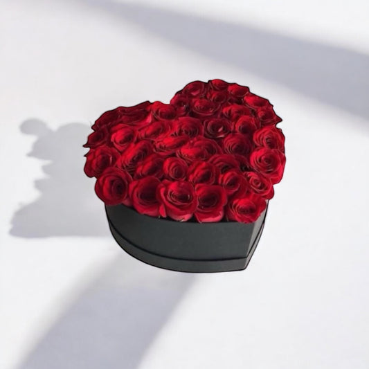 Heart-shaped box of red roses for same day flower delivery from local florist, romantic gift online with free shipping USA-wide.