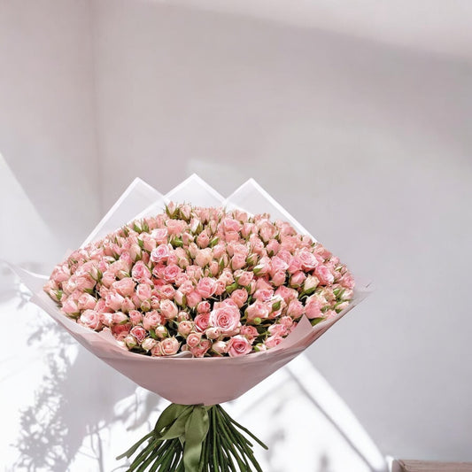 Fresh pink spray roses bouquet in basket, same day flower delivery, local florist near me, best floral arrangement with free shipping included.