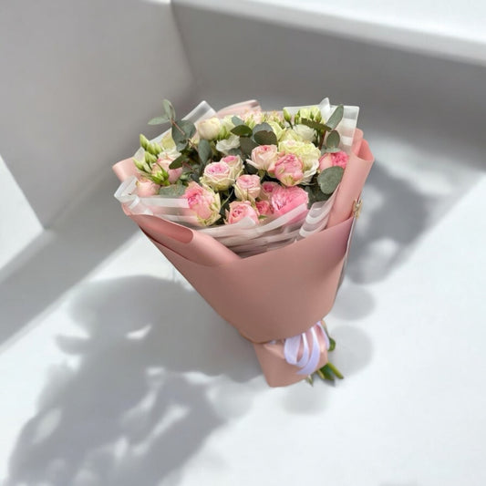 Beautiful bouquet of pink, white, and yellow roses arranged in a stylish basket, fresh flowers delivered same day with free shipping and local florist service.