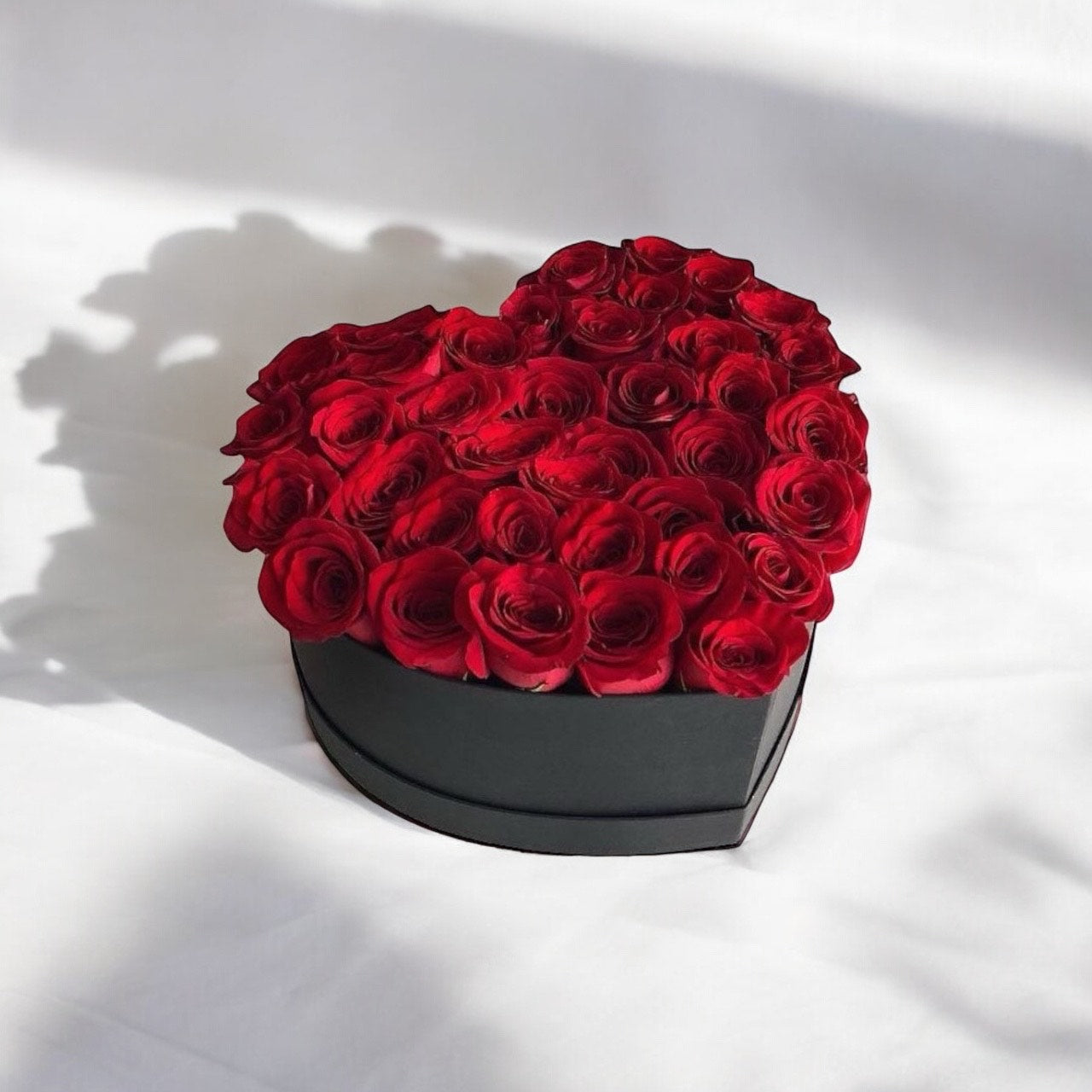 Exquisite Elegance 51 red roses in a black heart box