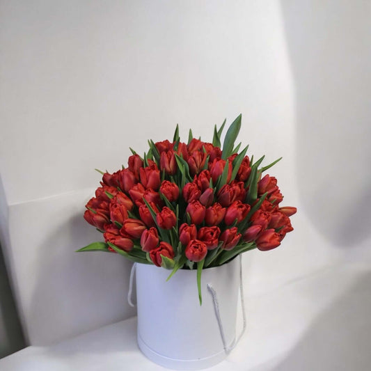 Boxed red tulips bouquet with fresh flowers and same day flower delivery